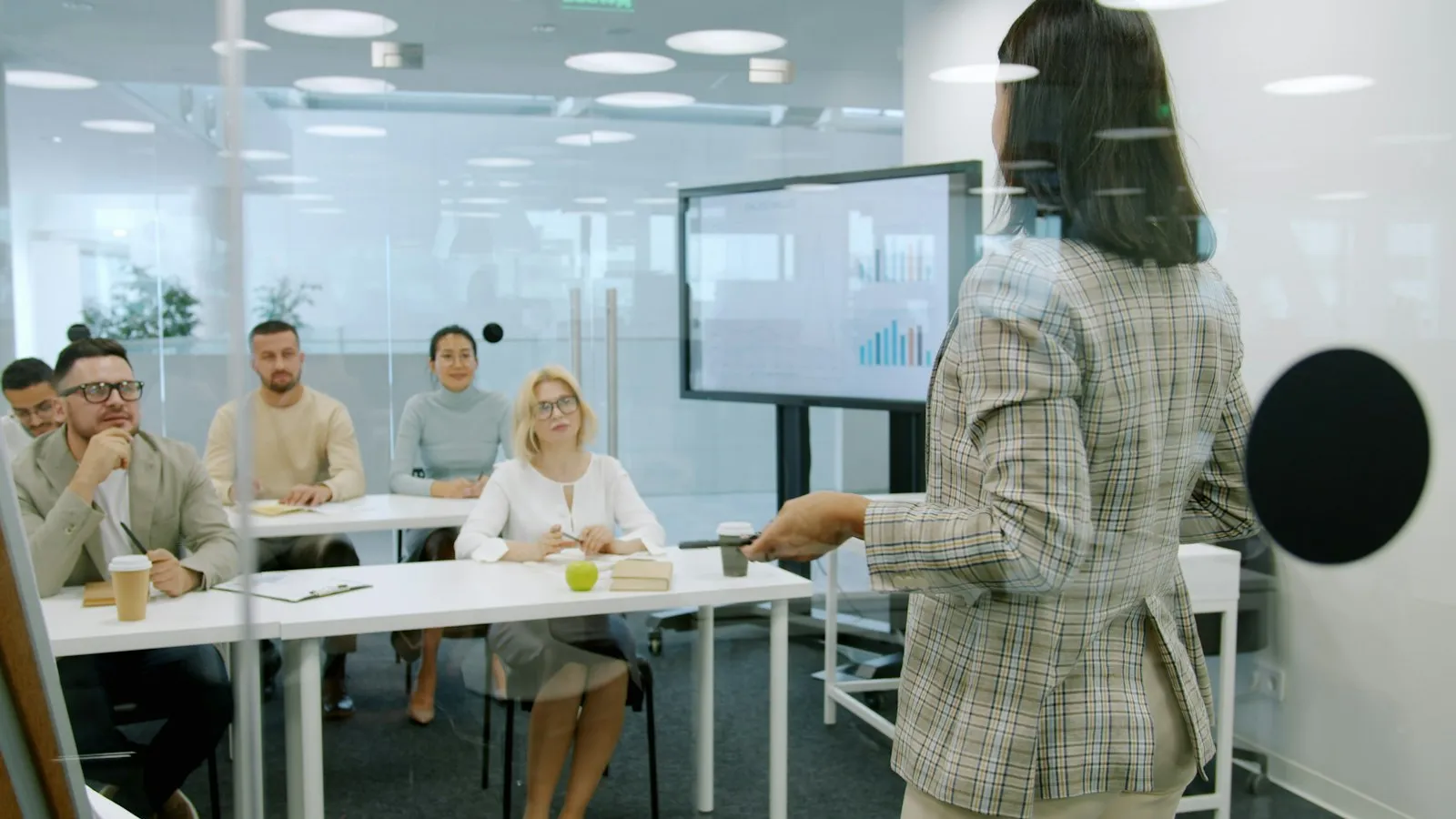 A team member presenting to colleagues in a training session