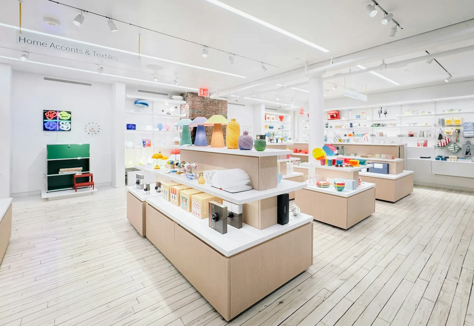 A bright, modern retail store with products on display tables