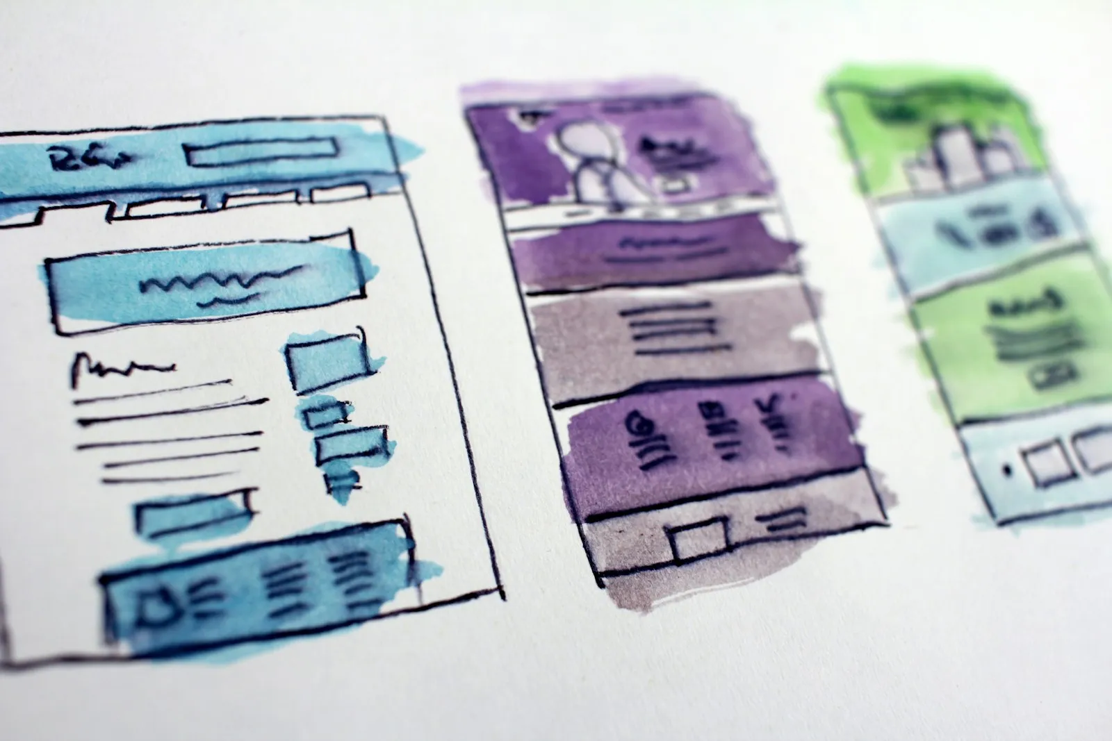 Hand-drawn wireframe sketches of web app screens