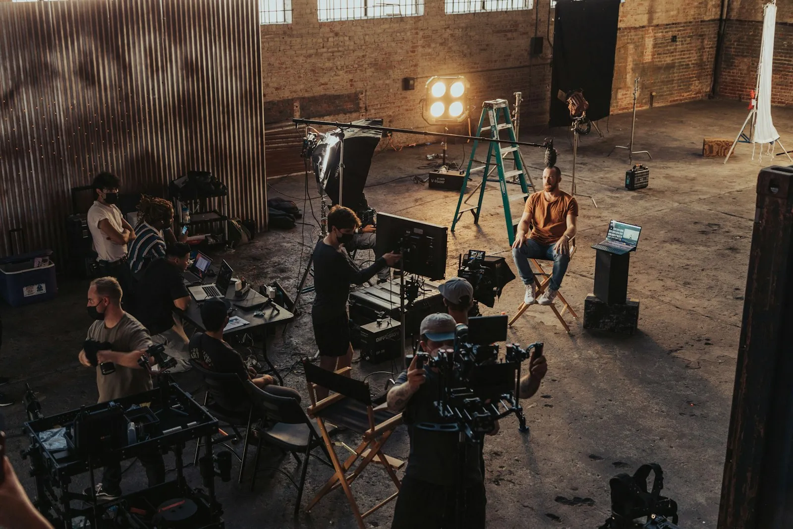 A film crew setting up a scene in a studio