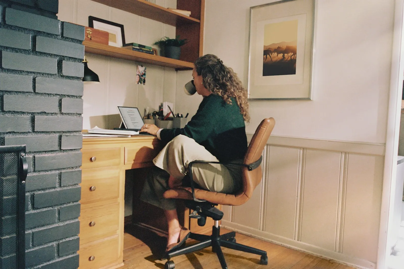 A person working at a desk in a home office