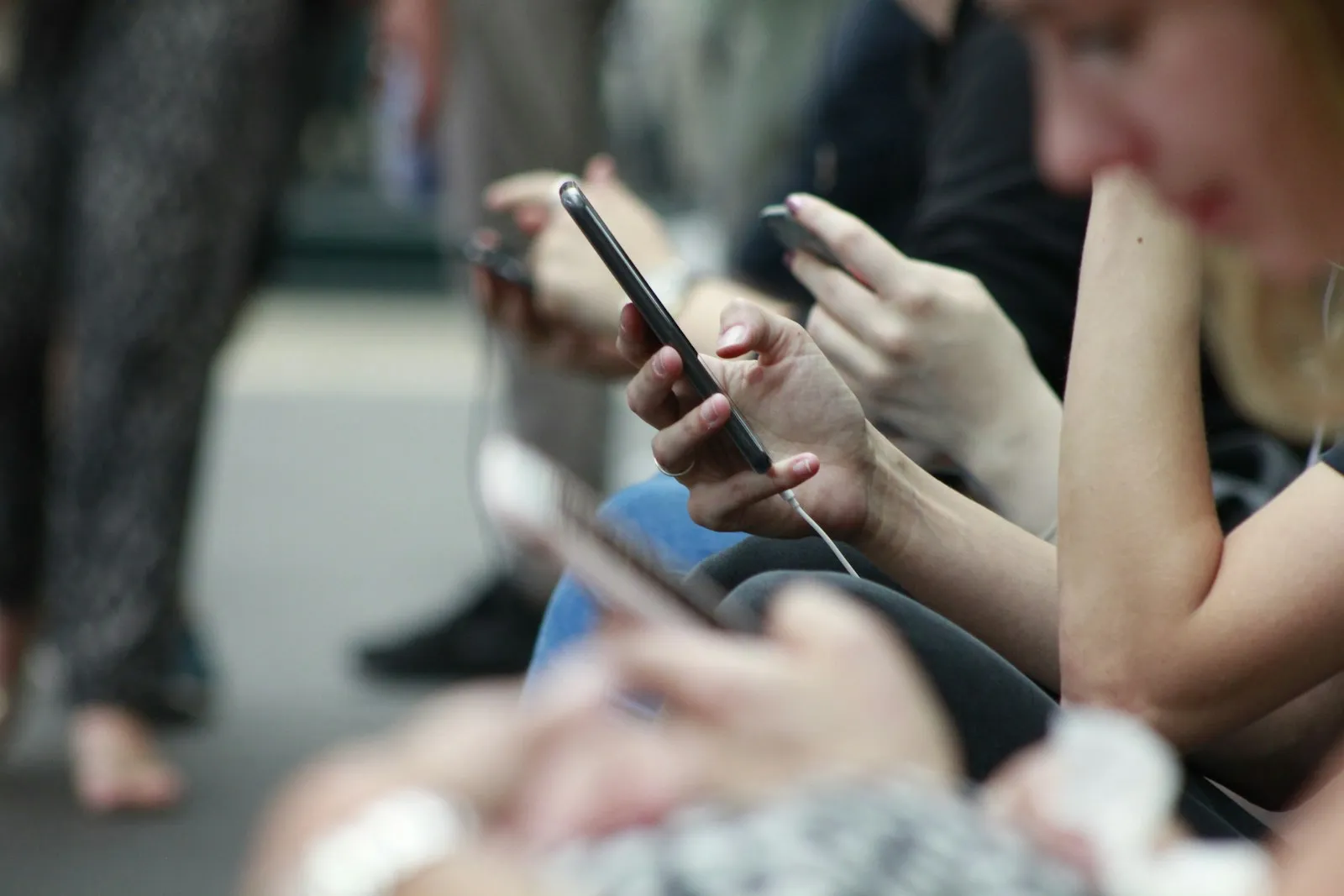 People scrolling social media on their phones